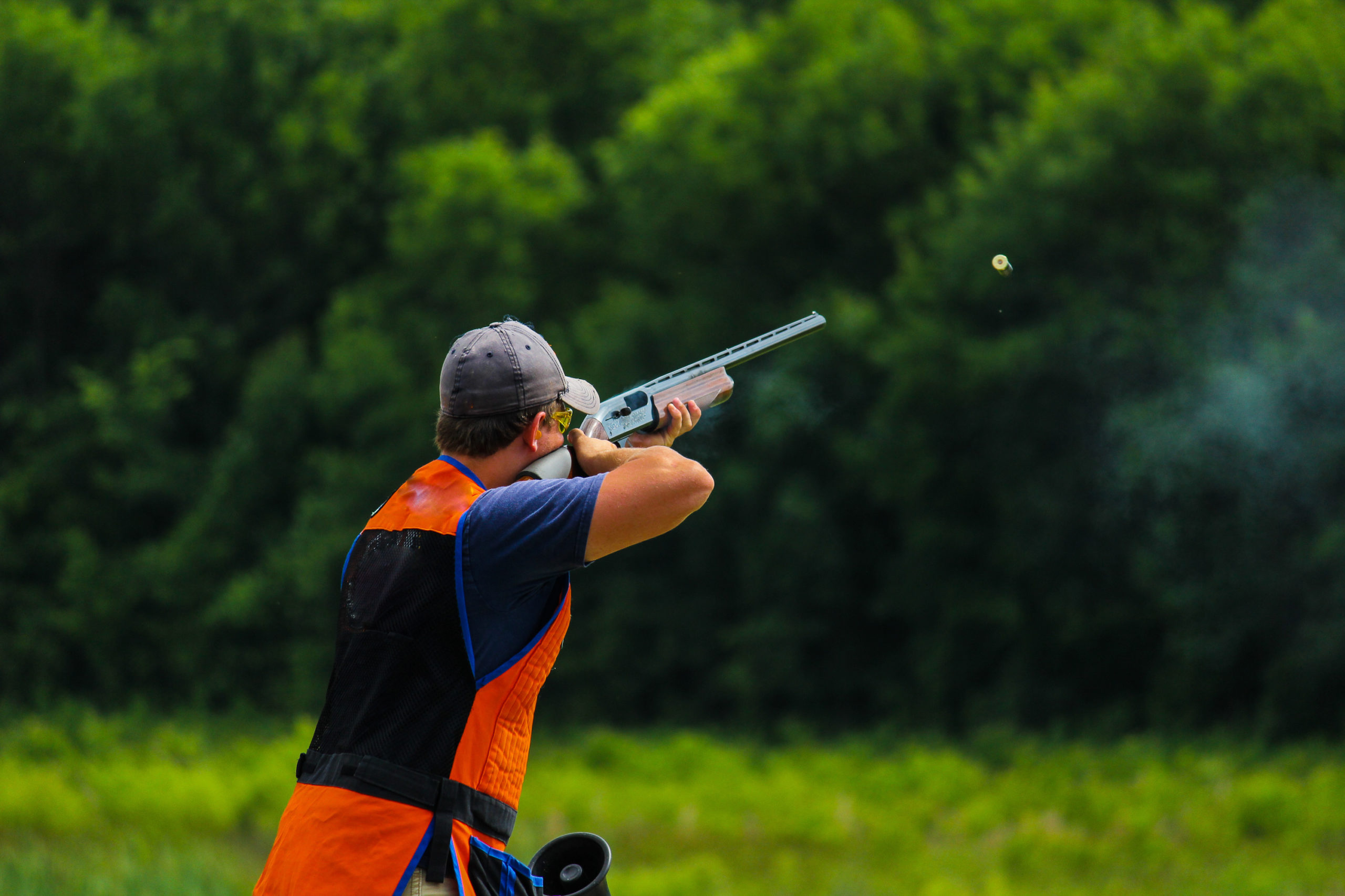 Young,Man,Skeet,Shooting,Outdoors;,Shooting,Clay,Pigeon,Targets,At